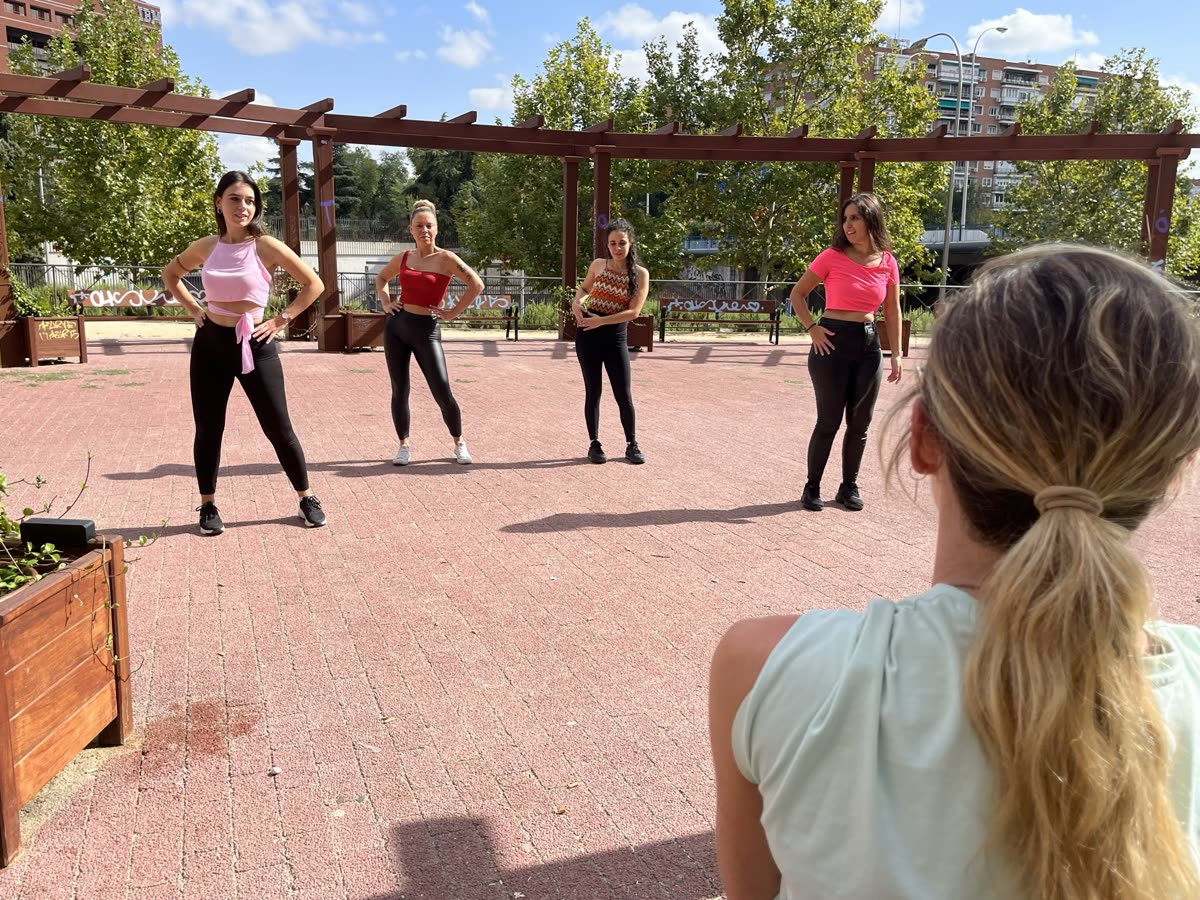 Ola leading a small group class outdoors