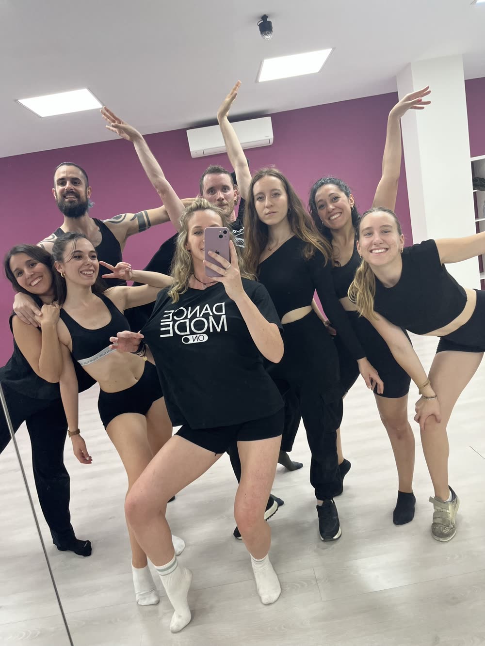 A group class posing together in the studio after a session