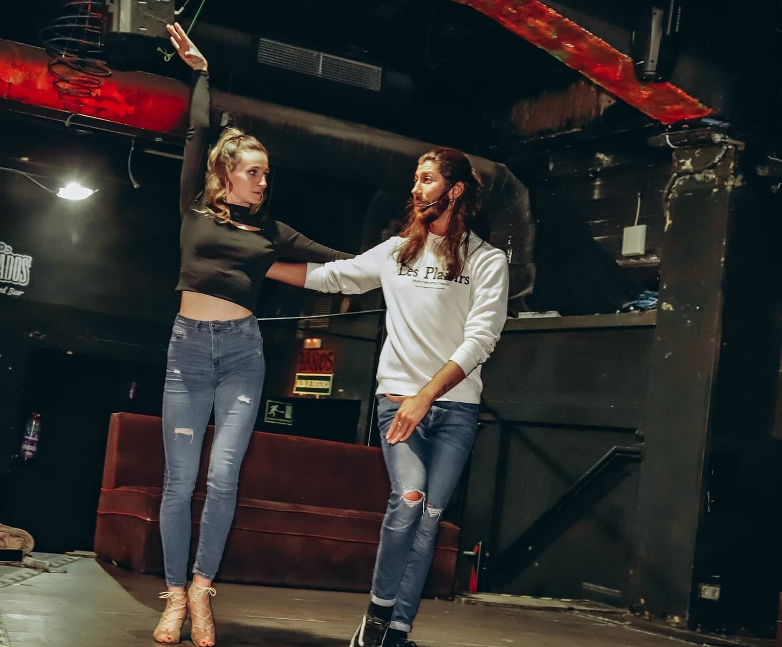 A couple working on partner connection during a private lesson