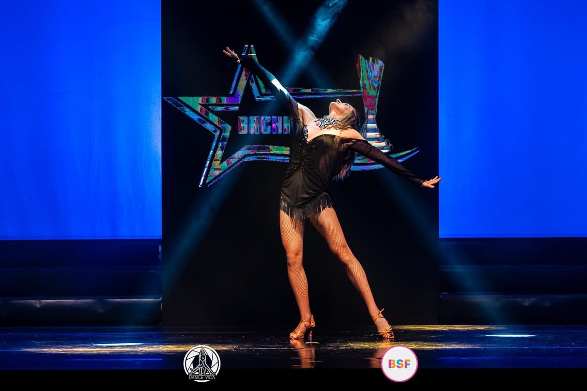 Ola performing on stage, showcasing her international dance experience