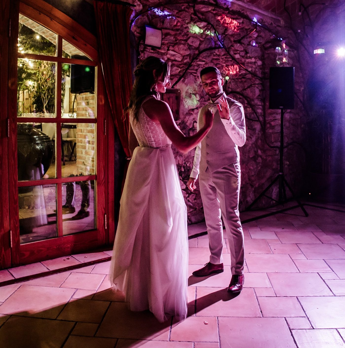 A couple dancing closely together at their wedding